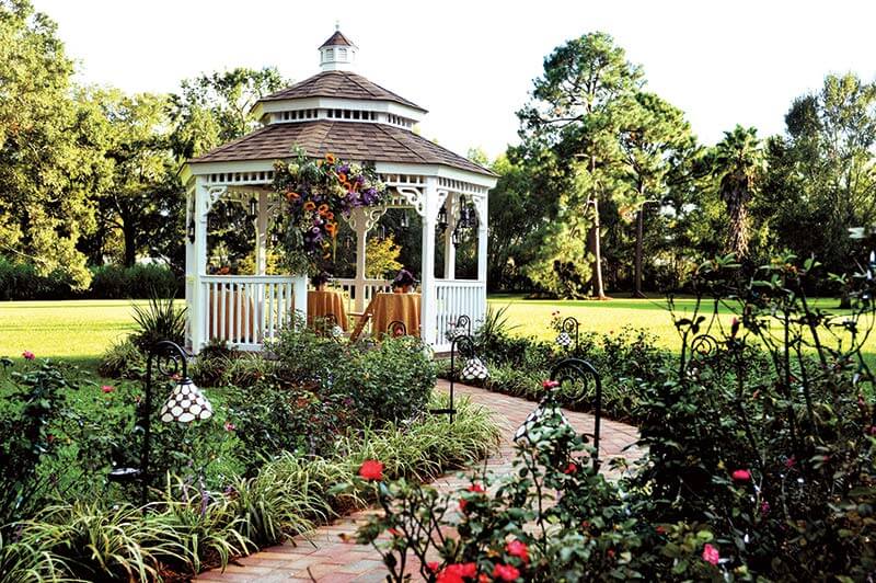 Modern backyard with pergola, kids' playhouse, and outdoor seating - summer upgrade inspiration